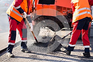 Street resurfacing. Fresh asphalt construction. Bad road.