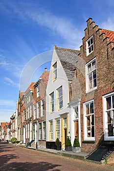 Street with row of ancient brickwork mansions, Veere, Netherlands