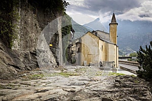 A street and the Saint Orso chapel in Donnas town