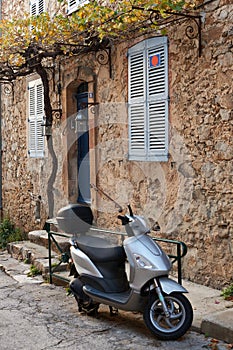 Street in Saint Tropez with moped