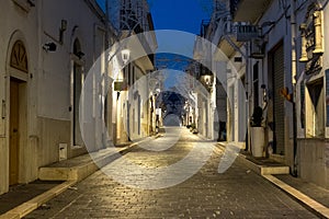 Street scene in Mattinata, on the Adriatic coast in the Gargano Peninsula, Puglia, Italy. Photographed at night in late summer.