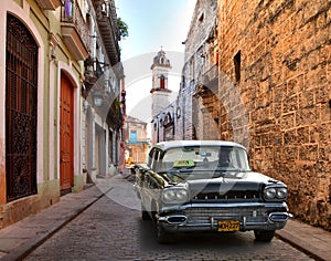 Street scene with an old rusty american car