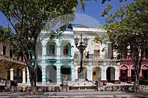 Street scene with traditional colorful buildings in downtown Havana, Prado