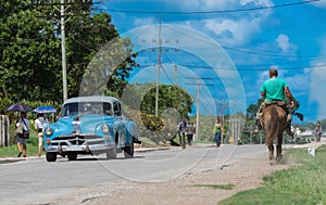 Street scenery with peoples and classic car in the countryside from Cuba - Serie Kuba 2016 Reportage