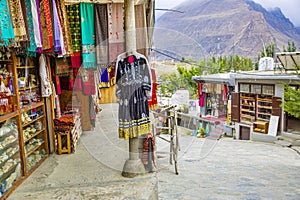 Street with shop with clothes and other souvenirs in Karimabad, Pakistan