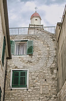 Street of Sibenik, Old Town, with bell tower of the Church of St Barbara