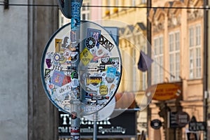 Street sign covered with stickers in Prague old town