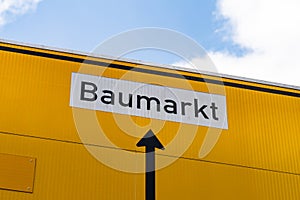 Street Sign Directing to a Baumarkt (Hardware Store)
