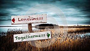 Street Sign Togetherness versus Loneliness photo