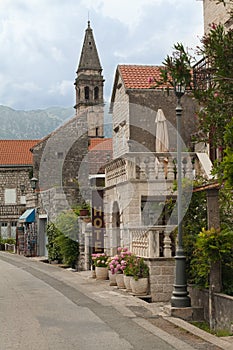 Street with sign of Hotel in old town of Montenegro.