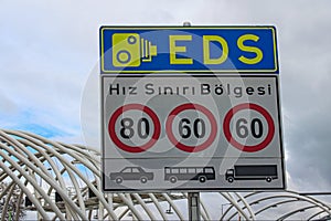 Street sign in Instanbul. Text on sign: Speed limit zone. Electronic Controlling System EDS Istanbul, Turkey photo