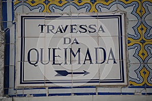 Street sign with mosaic tiles in Lisbon, Portugal photo