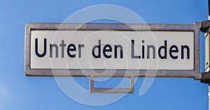 Street sign with name under the lime tree Unter den Linden in