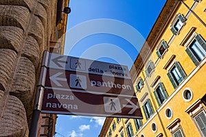 Street sign on old buildings Historic Rome city Italy