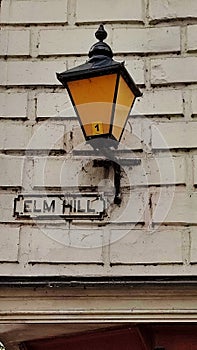 Street Sign and Old Lamp, Elm Hill, Norwich Norfolk, England. UK