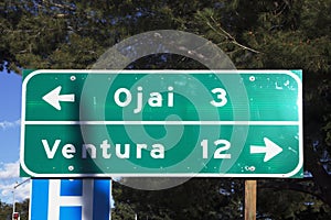 Street sign pointing to Ventura and Ojai, California, USA photo