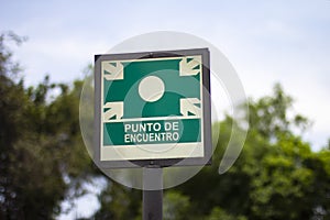 Street sign of `punto de encuentro` meeting point photo