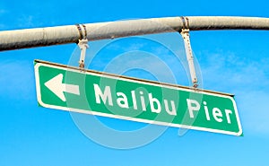 Street sign saying Malibu Pier on a sunny day