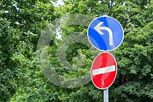 Street sign showing wrong direction and having to turn left