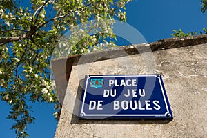Street sign at a square here people play jeu de boules photo