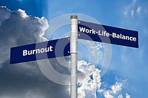 Street sign symbolizing choice between `burnout` and `work-life-balance`