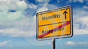 Street sign to humility versus arrogance