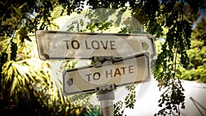 Street Sign LOVE versus TO HATE