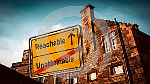 Street Sign to Reachable versus Unattainable photo