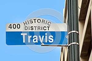 street sign travis in downtown Houston, Texas