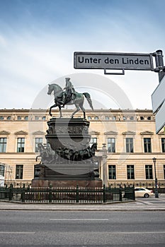 Street sign Unter den Linden and statue of Frederick the Great