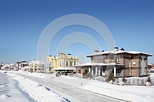 Street in small cottage settlements in winter photo