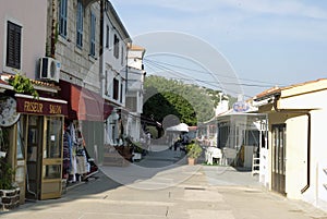 Street with souvenier shops and restaurants in Baska on Krk island in Croatia