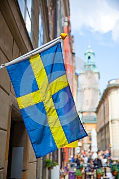 Street in Stockholm with swedish flag