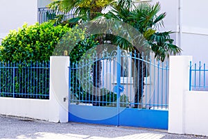 Street suburb home blue classic house or gate garden access