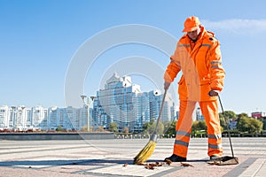 Street sweeper cleaning city sidewalk photo