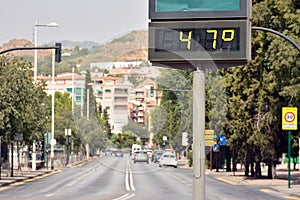 Street thermometer marking 47 degrees photo