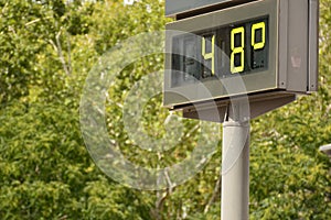 Street thermometer marking 48 degrees photo