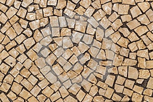 Street tile in Portugal. Light stone as a paving material.