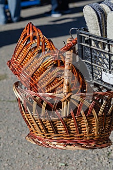 Street trade. Traditional fair. Wicker baskets next to the counter with insoles for shoes.  Daytime. No people. Selective focus