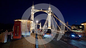 Street traffic on Albert Bridge London by night - LONDON, ENGLAND - DECEMBER 10, 2019