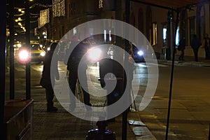 Street traffic photography team by night