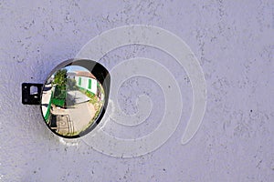 Street traffic wall convex mirror in road safety concept in city center