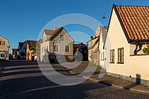 Street with typical buildings in the old town of Visby on the is