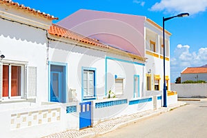 Street with typical Portuguese white houses in Sagres, the municipality of Vila do Bispo, southern Algarve of Portugal photo