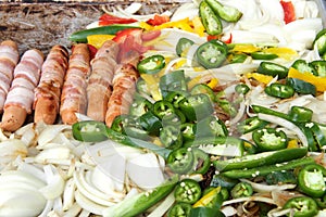 Street vendor grill with hot dogs and veggies