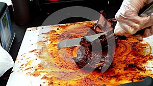 Street Vendor Preparing Rack of Ribs