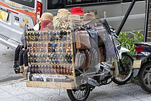 Street vendor sell fake branded bag to tourist in Danang, Vietnam