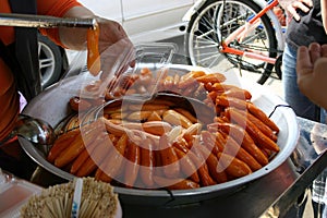 Street vendor selling braised sweet potato