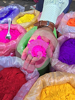 Street vendor selling colourful Holi Color powders