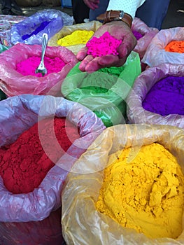 Street vendor selling colourful Holi Color powders